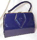 Navy shiny vinyl handbag with front button trim